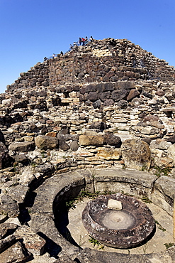 Tourists, at the ruins, Nuraghe Su Nuraxi, Barumi, Sardinia, Italy