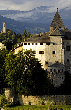 Medieval Proesels castle in front of overcast mountains, Voels am Schlern, South Tyrol, Alto Adige, Italy, Europe