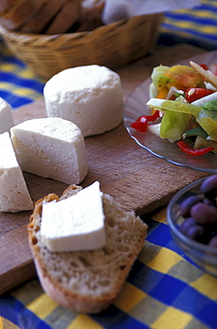 Goat cheese and bread on a table, Serra do Caldeirao, Tavira, Algarve, Portugal, Europe