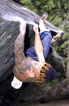 Climber bouldering, Avers Valley, Grisons, Switzerland