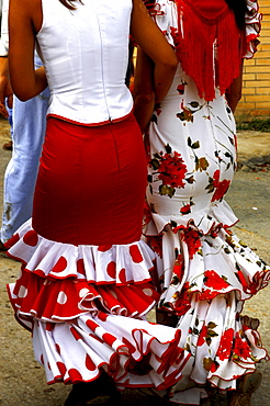 Women wearing Flamenco dresses, Seville, Andalucia, Spain, Europe