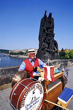 Musician at Charles Bridge in the sunlight, Prague, Czechia, Europe