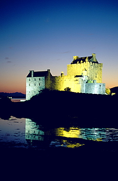 The illuminated Eilean Donan castle at night, Ross and Cromarty, Highlands, Scotland, Great Britain, Europe