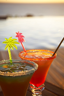 Colourful cocktails at the pool of Hotel Restaurant Le Rayon Vert in the evening, Deshaies, Basse-Terre, Guadeloupe, Caribbean Sea, America