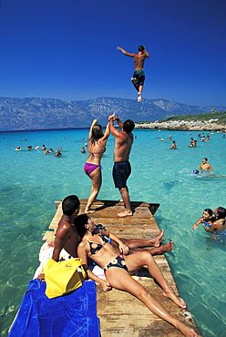 People on the wooden footbridge, Cleopatra Beach, Marmaris, Aegean sea, Turkey