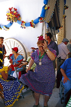 Mature woman dancing Flamenco, El RocÃŒo, Andalusia, Spain