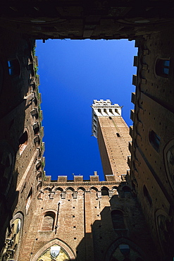 Low angle view of Torre del Mangia Tower, Siena, Tuscany, Italy