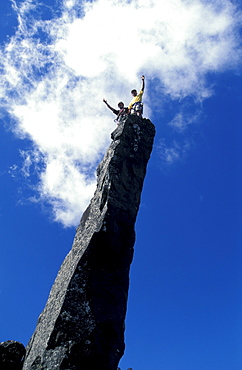 Two climbers standing on the top of a mountain peak, Trois Salazie, Gros Morne, Ille de la RÃˆunion, Indian Ocean