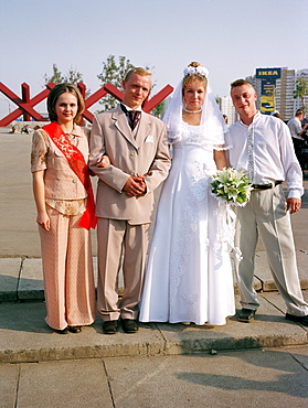 Newlyweds posing in front of the war memorial, Khimki, Moscow, Russia