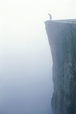 Person standing on a precipice, Stavanger Rogaland, Norway