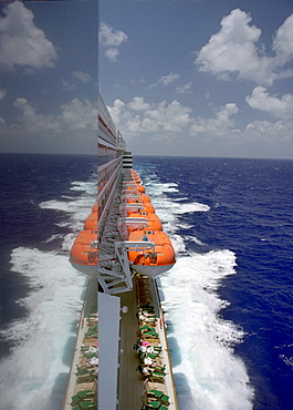 View at passengers and life boats along deck seven at the cruise ship Queen Mary 2