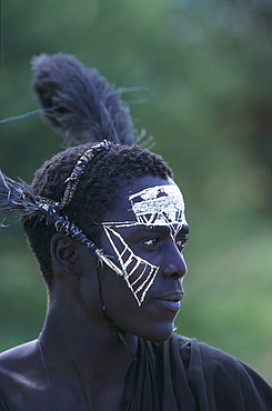 Young Massai Tribesman with traditional facial painting, Tanzania, Afrika