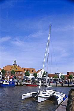 Houses and harbour under clouded sky, Toenning, Eiderstedt peninsula, Schleswig Holstein, Germany, Europe