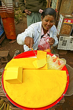 fresh yellow tofu for sale, Market Bago, Myanmar