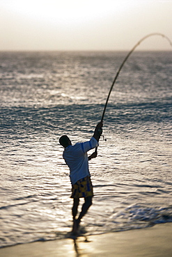 Man is fishing at the beach of SÂ·o Pedro, SÂ·o Vicente, Cape Verde, Africa