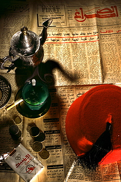 Newspaper, peppermint tea and cigarettes on the table at a teahouse, Fes, Morocco, Africa