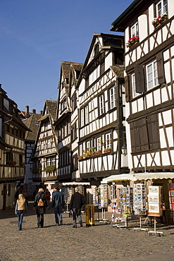 People passing a souvenir shop at Place Benjamin Zix, People passing a souvenir shop at Place Benjamin Zix, La Petit France Little France, Strasbourg, Alsace, France