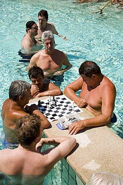 Men playing chess in a thermal bath, Men playing chess in a thermal bath of the Szechenyi-baths, Pest, Budapest, Hungary