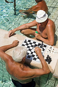 Men playing chess in a thermal bath, Men playing chess in a thermal bath of the Szechenyi-baths, Pest, Budapest, Hungary