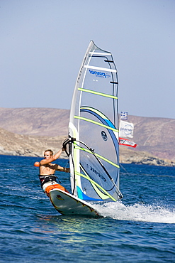 Surfer in action at Kalafati Beach, Kalafati, Mykonos, Greece