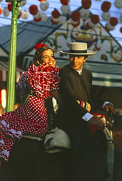 Couple on a horse, Feria de Abril, Sevilla, Andalusia, Spain111