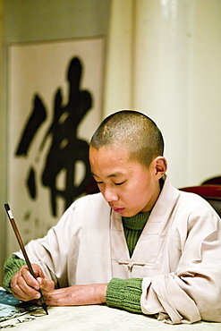 young monk with calligraphy brush, evening school, Xixiang Chi monastery and temple, Elephant Bathing Pool, China, Asia, World Heritage Site, UNESCO