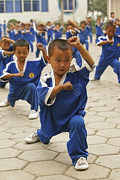 Kung Fu training at kindergarten age, at one of the many new Kung Fu schools in Dengfeng, school near Shaolin, Song Shan, Henan province, China, Asia