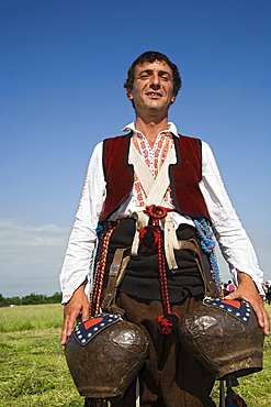 Man in traditional costume with bells, Rose Festival, Karlovo, Bulgaria, Europe