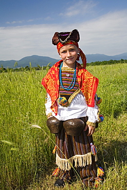 Boy in traditional costume with bells, Rose Festival, Karlovo, Bulgaria, Europe