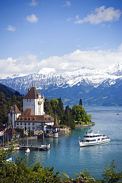 Excursion Boat at Castle Oberhofen at Lake Thun, Eiger (3970 m), Moench (4107 m) and Jungfrau (4158 m) in background, Oberhofen, Bernese Oberland (highlands), Canton of Bern, Switzerland