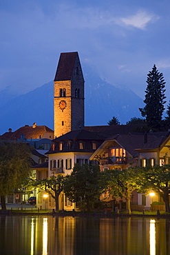 View over river Aare to Unterseen (the highest town on the Aare) at night, Interlaken, Bernese Oberland (highlands), Canton of Bern, Switzerland