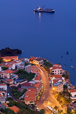 Houses on the coast in the evening, Camara de Lobos, Madeira, Portugal