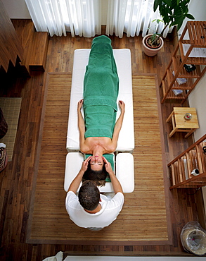 Woman having an Ayurvedic head massage, Spa area, Spa Hotel Seehotel Neuklostersee, Mecklenburg Western Pomerania, Germany