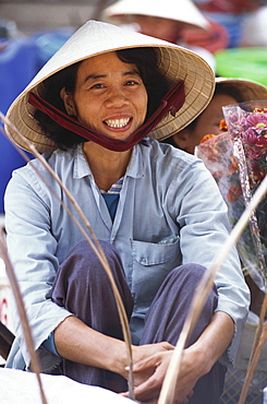 A local woman, vendor at a market, City Life, Hoi An, Vietnam