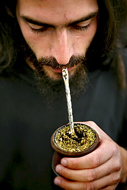 Argentinian man drinking mate, Argentinia, South America