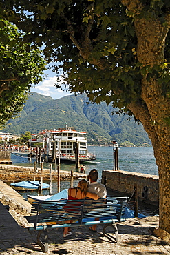 Switzerland, Ticino, Ascona Lago Maggiore Ferry pier couple