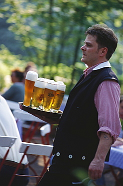 A waiter serving beer in a beer garden, Weissbier, Beer, Leisure, Germany