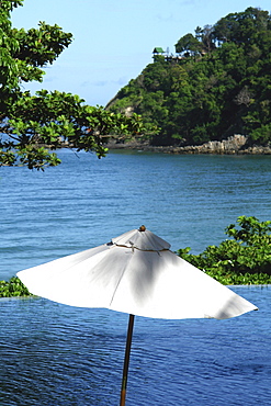 Sun shade on the pool, sea in the backround, Koh Lanta, Ko Lanta, Thailand, Asia