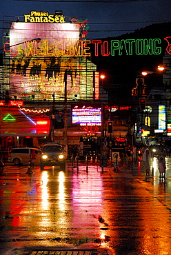 Neon lights reflecting on the wet road of Soi Bangla, Patong, Phuket, Thailand