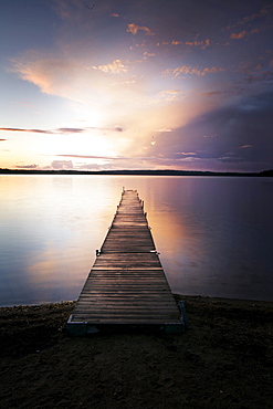 Jetty at a lake at sunrise Madkroken near Vaexjoe, Smaland, Sweden