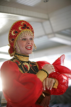 Singer in traditional Russian costume, tour boat on Newa river, St. Petersburg, Russia