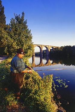 Angler fishing, Railway viaduct in the background, Herdecke, Ruhr Valley, Ruhr, Northrhine Westphalia, Germany