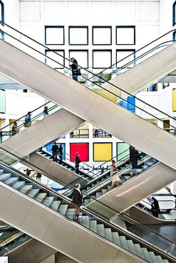 People, business people on escalators, Berlin Exhibition, Berlin, Germany