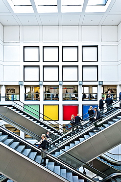 People, business people on escalators, Berlin Exhibition, Berlin, Germany