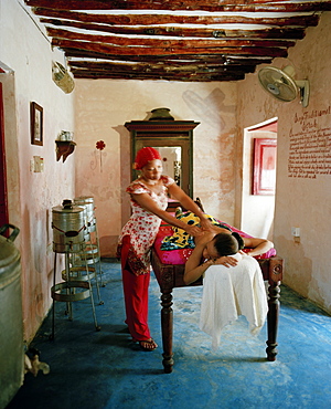 Therapist Acha giving a massage at Mrembo Spa, Mrembo means beautiful woman, old house in the center of Stone Town, Zanzibar, Tanzania, East Africa