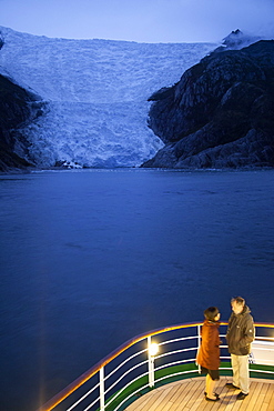 Couple on deck of cruise ship MS Deutschland, Reederei Peter Deilmann, near terminal of Italian Glacier, Chilean fjords, Magallanes y de la Antartica Chilena, Patagonia, Chile, South America