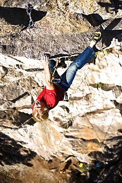 A man climbing up a rock face, Oetztal, Tyrol, Austria