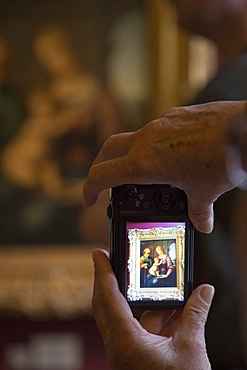 Painting Mary Magdalen taken up to heaven by Domenico Zampieri in display of compact digital camera inside The Hermitage museum complex, St. Petersburg, Russia, Europe