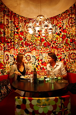 Couple inside hotel's on-site restaurant, Brussels, Belgium