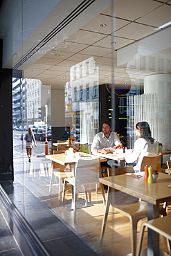 Couple inside a breakfast restaurant of a hotel, Brussels, Belgium